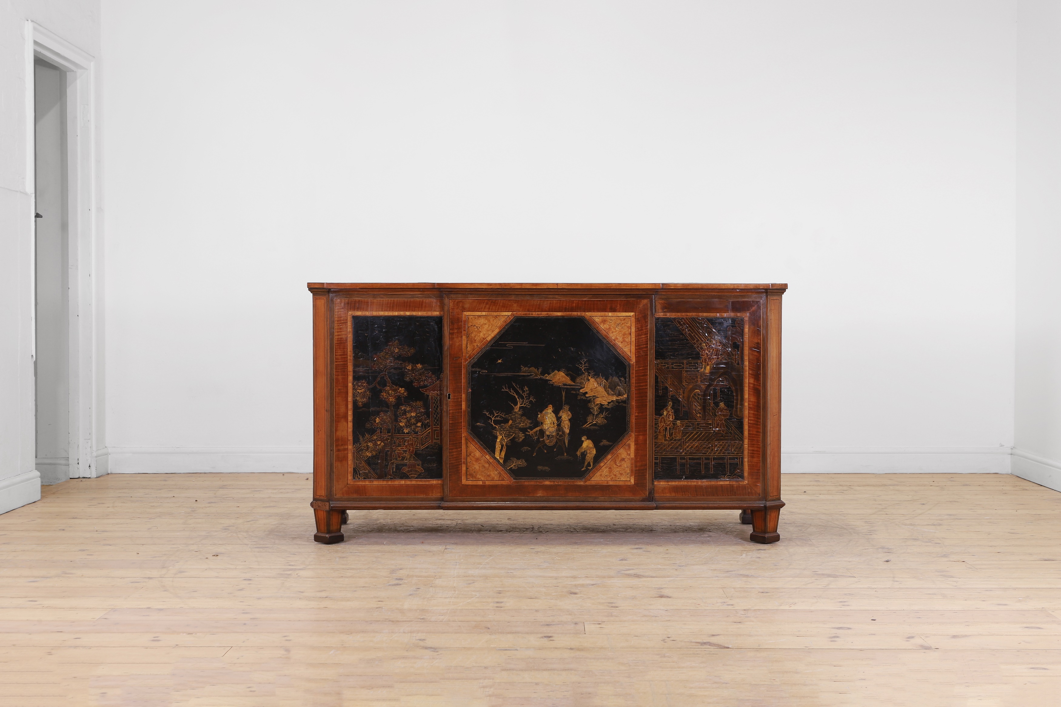 A satinwood, harewood and japanned cabinet (£3,000-5,000)